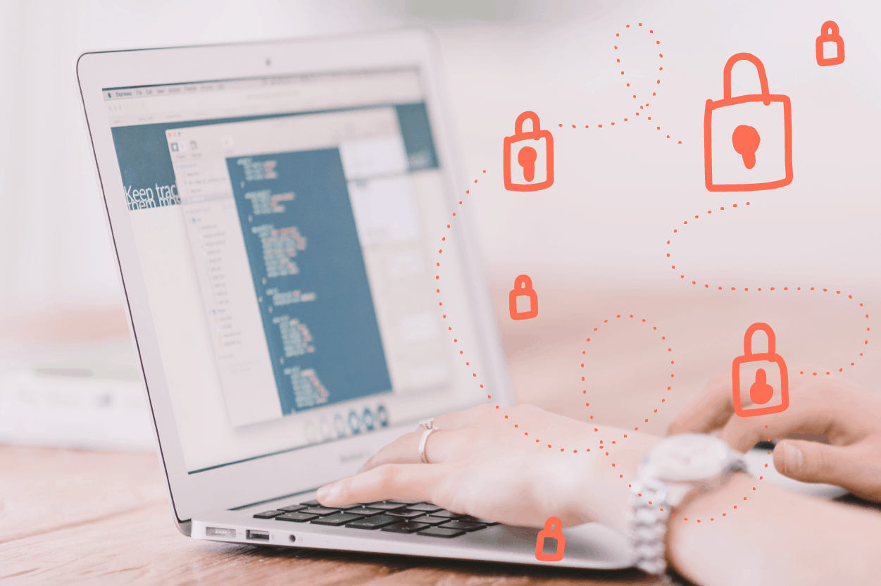 Hands typing at a laptop computer. Images of locks float above the user's hands to visualize online user data privacy