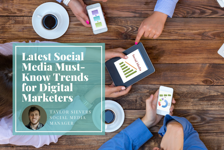 hands reaching into table with tablets and phones with social media terminology. Overlaid on top of that is a transparent box with the title 'Latest Social Media Must-Know Trends for Digital Marketers' written by Taylor Sievers, Social Media Manager