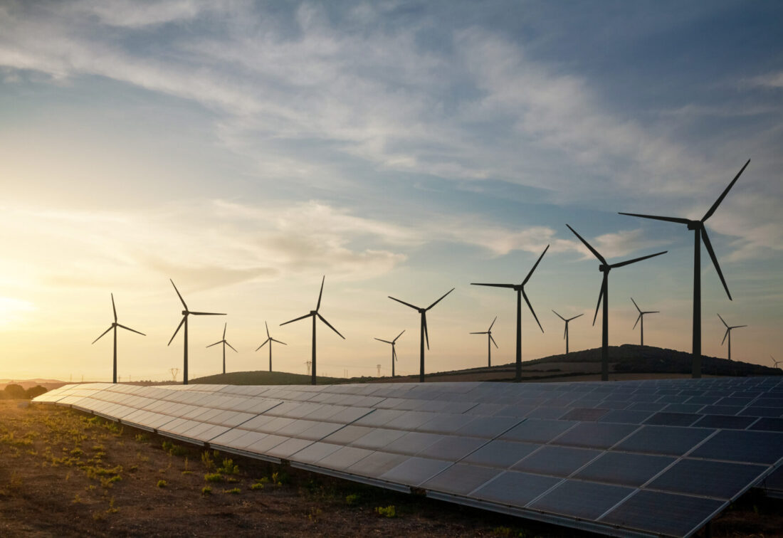 Solar panels and wind turbines generating renewable energy for green and sustainable future.