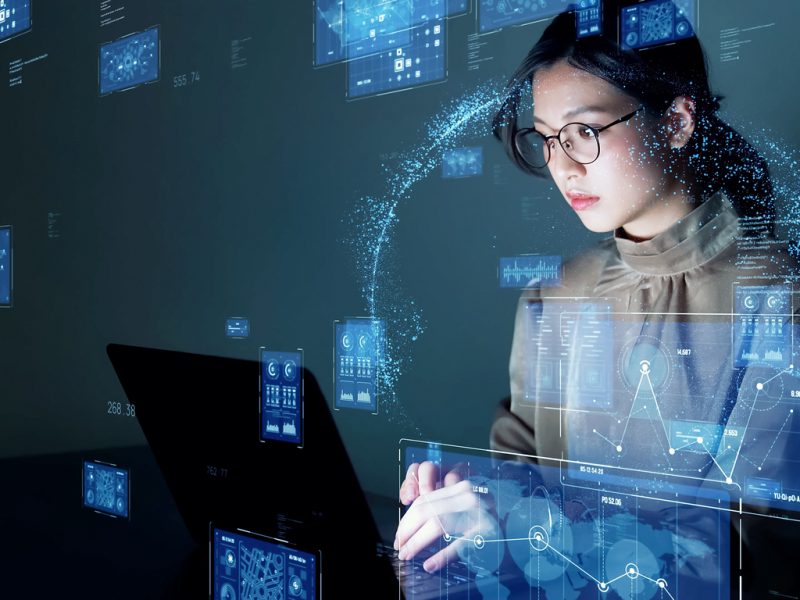 Young asian woman watching hologram screens. Business technology. Young asian woman watching hologram screens. Business technology.
